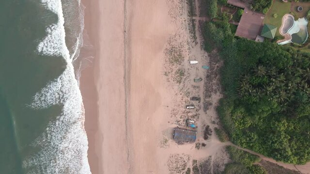 goa Sinquerim Beach drone shot shack view from the beach to waves top birds-eye view  over the beach