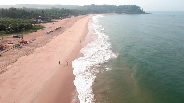 goa Sinquerim Beach drone bird's eye view drone coming blue goa beach
