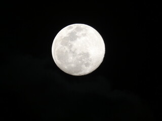 Obraz na płótnie Canvas full moon over blue sky