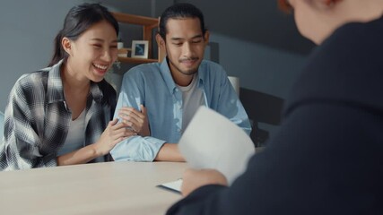 Happy asia young customer couple ready sign bank loan agreement for new house with broker agent, smiling husband and wife consider finance investment insurance contract together in front of broker. - Powered by Adobe