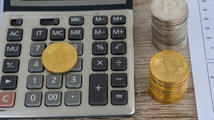 Gold coin with bitcoin symbol on a separate graph on digital coin