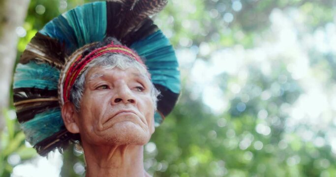 Indian from the Patax&oacute; tribe, with feather headdress. Brazilian Indian. 4K.