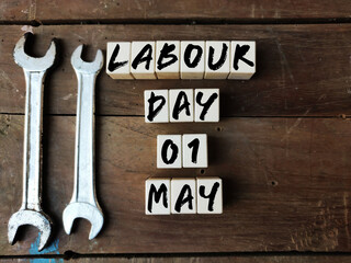 International Labour day Concept on 1st May with blocks with text written on write blocks, copy space Top view.