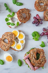 freshly baked whole grain bagels. heap of fresh baked bagels