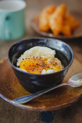 Soft-boiled eggs on color wooden background