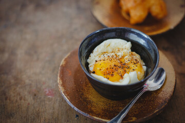 Soft-boiled eggs on color wooden background