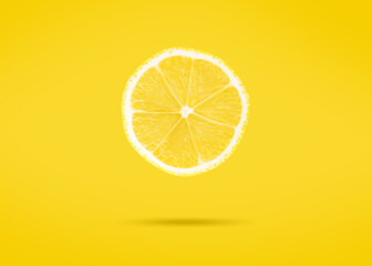 Slice of lemon over yellow