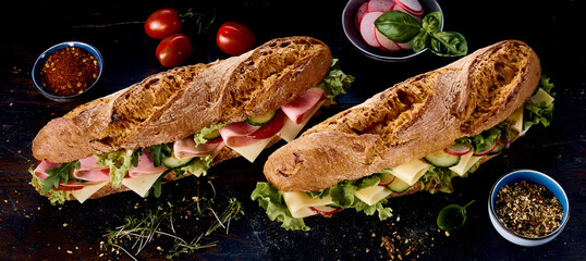 Delicious sub sandwiches amidst natural ingredients