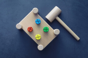 Children's development. Children's wooden toy on the table in the play area. Room of children's creativity and self-development. Wooden constructor.