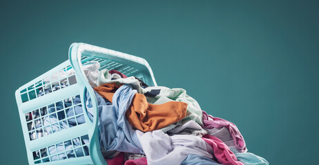 Heap of dirty clothes and laundry basket - obrazy, fototapety, plakaty