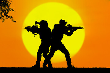 Army soldier 2 with rifle orange sunset silhouette