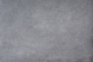 Gray concrete wall background with texture and scuffs