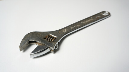 Adjustable wrench on a white background.