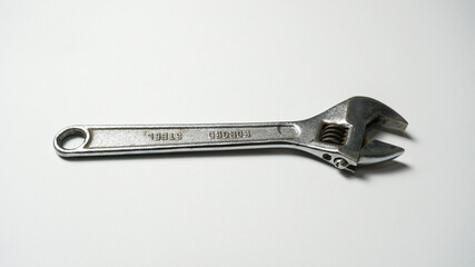 Adjustable wrench on a white background.