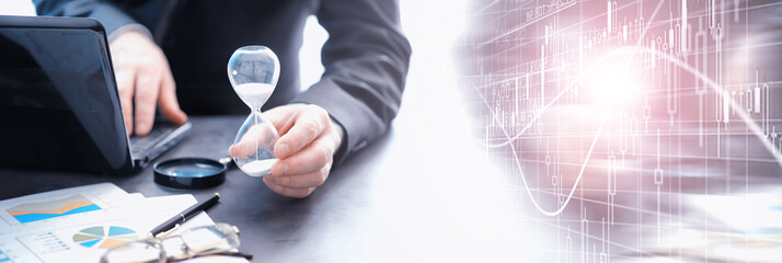 Working time symbolizes an hourglass. Office desk of insurance manager and banker. Office employee at the table. The concept of lack of time.