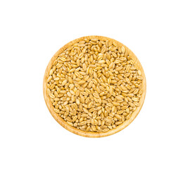 Uncooked dry wheat grains in wooden bowl on white background, top view.