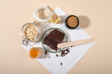 Chocolate face and body scrub. Homemade spa cosmetic recipe. Home beauty concept.