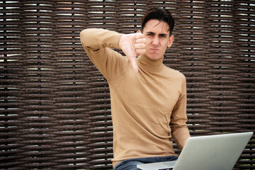 Funny young man with laptop. Freelancer and web design. Business strategy. Online training in the...