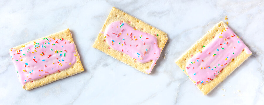 Strawberry pop tart panoramic banner on a white marble background