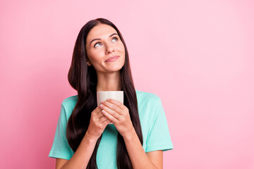 Photo of young lovely pretty happy positive dreamy girl look copyspace drinking coffee isolated on pink color background