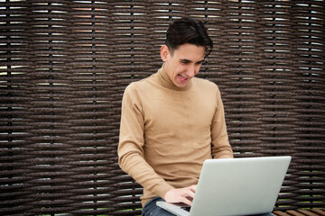Funny young man with laptop. Freelancer and web design. Business strategy. Online training in the...