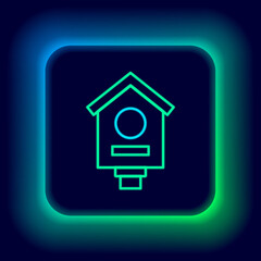 Glowing neon line Bird house icon isolated on black background. Nesting box birdhouse, homemade building for birds. Colorful outline concept. Vector
