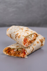 doner with meat filling in a cut on a gray background