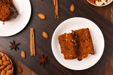 Carrot and dates cake made with dried fruit, raisins, cashew nuts, almond. Tasty home made cake flavored with cinnamon , spices on Christmas and new year Kerala India Sri lanka. Sweet dessert food.