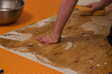 whiping down wooden subflooring with a sponge