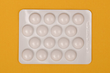 pack of pills isolated ona red backgound 