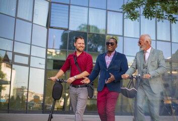 Three business man on street. Two men with electric scooter.