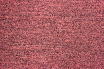 Light red knitwear fabric texture, abstract background, sweater fragment