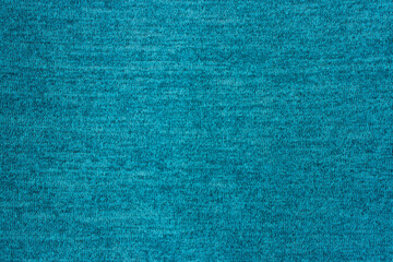 Blue knitwear fabric texture, abstract background, sweater fragment