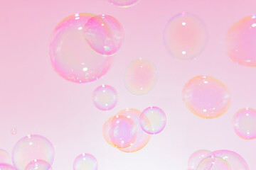 Beautiful Transparent Pink soap Bubbles Float Background.