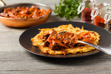 Hungarian potato pancake with goulash