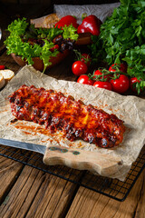 spicy spare ribs with baked potatoes and sour cream