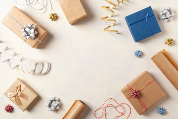 Gift Wrapping. A bright background with packaging accessories and gifts. Creative composition....