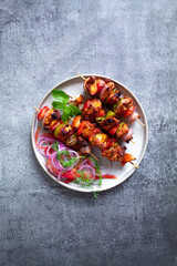 Chicken Skewers with some a side salad top view
