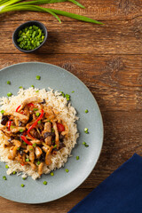 Pork chop with peppers, mushrooms and bamboo. Served with rice.