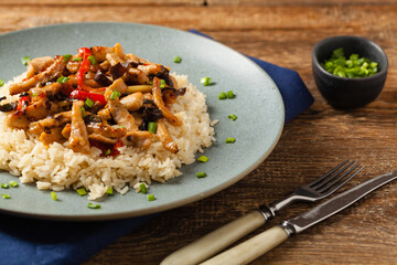 Pork chop with peppers, mushrooms and bamboo. Served with rice.