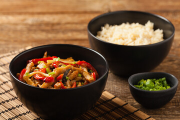 Pork chop with peppers, mushrooms and bamboo. Served with rice.