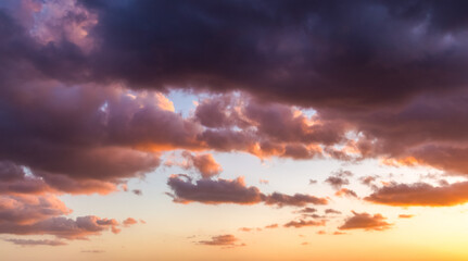 Naklejka na ściany i meble Colorful cloudy sky at sunset. Sky texture, nature background.