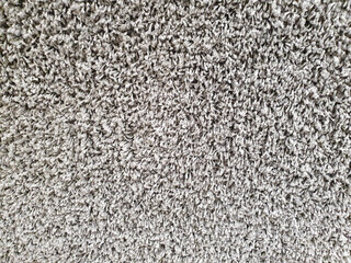Gray long pile carpet texture background. Top view. Polypropylene long pile carpet