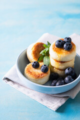 Cottage cheese pancakes. Cheesecakes from cottage cheese, delicious Breakfast, traditional Russian sweet pancakes. With blueberry, mint and honey