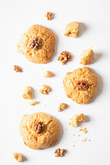 homemade cookies chocolate chips with nuts on a white background, top view