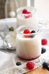 yogurt with raspberries in glass jars