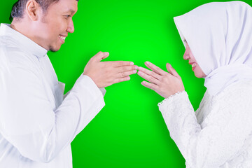 Woman shows congratulate hands Eid to husband