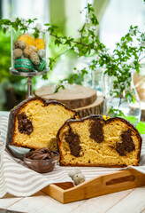 Panettone is the traditional Italian dessert for easter in 2021. Homemade panettone covered in chocolate. Sweet Bread served as dessert.