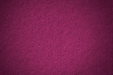 Magenta concrete textured background blank space with vignette
