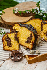 Fototapeta na wymiar Panettone is the traditional Italian dessert for easter in 2021. Homemade panettone covered in chocolate. Sweet Bread served as dessert.